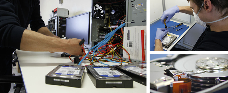 Data recovery technician examining a hard drive in a clean room environment