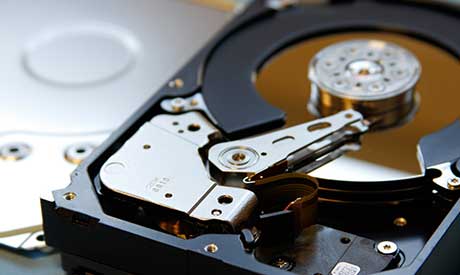 An open hard drive waiting for recovery